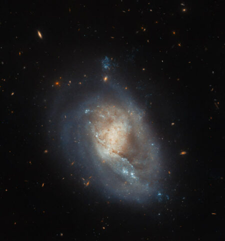 Hubble’s Discovery: Dwarf Spiral Galaxy Found in the Coma Constellation Hubble's Discovery: Dwarf Spiral Galaxy Found In The Coma Constellation