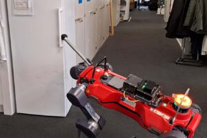 Robot Dog Masters Opening Door With Paw