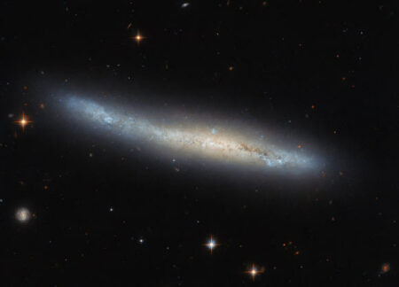 The Hubble Space Telescope Observes A Small Spiral Galaxy From