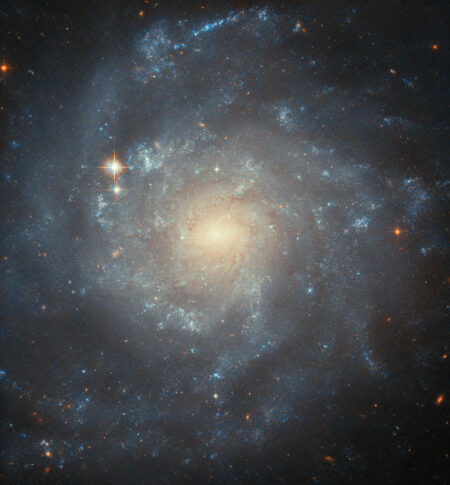 The Hubble Space Telescope Discovers A Spiral Galaxy Forming Stars