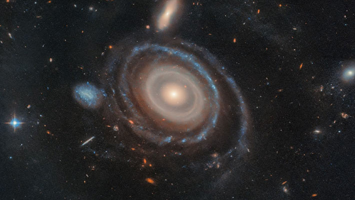 A ring filled with nine stars found orbiting a massive galaxy by astronomers A Ring Filled With Nine Stars Found Orbiting A Massive